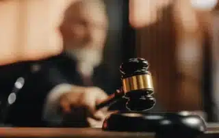 A judge hitting a gavel.