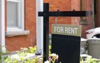For rent sign in front of a residential building. Real estate business