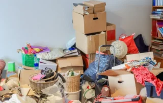 Hoarder's living room is filled with possessions. Hoarding disorder is a mental health problem. The homeowner doesn't want to let go of anything, not even trash.